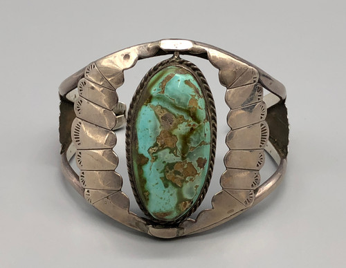 unique double sided spinner bracelet, twisted wire accenting two exquisite turquoise cabochons (in different shades), two wire terminal