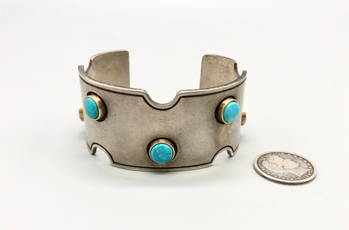 sterling silver, gold, and turquoise bracelet by award winning artist Edison Cummings, turquoise cabochons in 14K yellow gold bezels, smooth silver