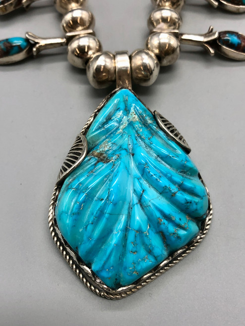 Bisbee turquoise squash blossom style necklace with large carved turquoise pendant, handmade beads, foxtail wire, Ernie Lister, Old Man Leekya