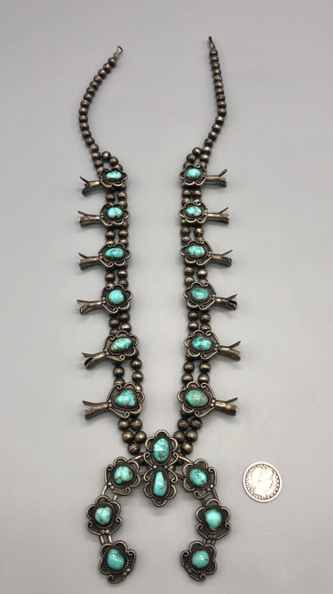 vintage squash blossom necklace, classic naja style with eight beautiful green turquoise cabochons, sterling silver and strung on a coated wire