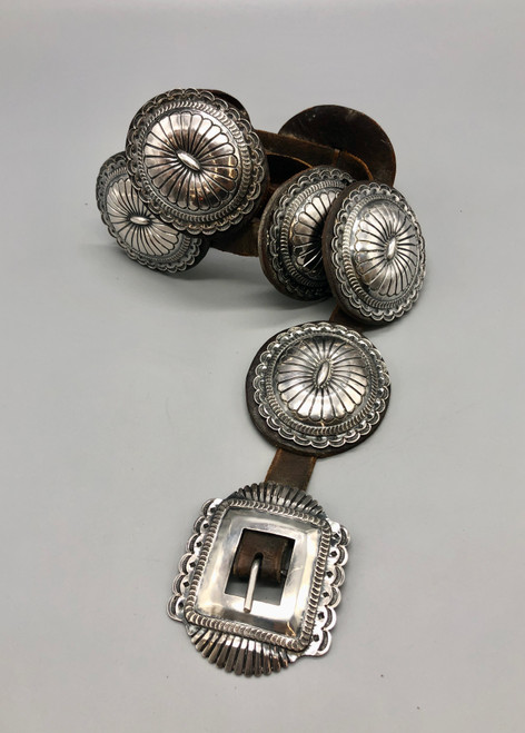 vintage sterling silver concho belt, phenomenal silverwork and intricate hand stamped designs, brown leather