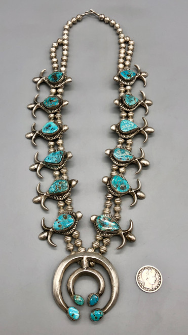 1960s sandcast fleur-de-lis style squash blossom necklace, sandcast naja, turquoise cabochons, handmade beads, coated wire