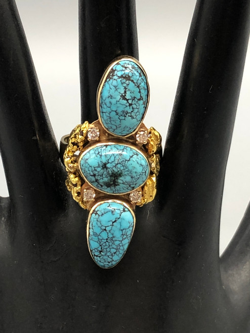 gold, diamond, and spiderweb turquoise ring by Elias, spiderweb turquoise cabochons on a 14K yellow gold band