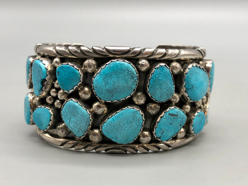 14-stone webbed turquoise bracelet, 14 incredible webbed turquoise cabochons in handmade sawtooth bezel, heavily detailed silverwork