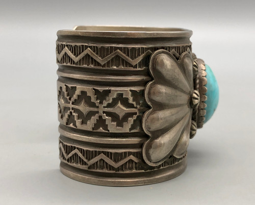 hefty turquoise and sterling silver bracelet, turquoise cabochon in a sawtooth bezel, twisted wire and silver applique