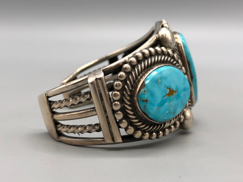 hefty three-stone bracelet by Navajo artist, Rick Martinez, retro style, well accented with twisted wire and silver dots, five wire terminal