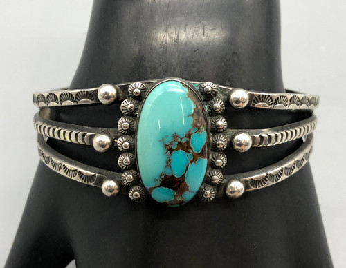 nice handmade bracelet with great turquoise, turquoise cabochon with silver dot accents, three wire terminals