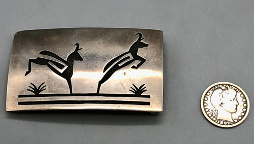 antelope themed Hopi overlay belt buckle by Nathan Fred, Jr., double antelope themed design with a stippled and darkened silver background