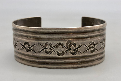 1940's, wonderful hand stamped designs with deep, silver lines throughout