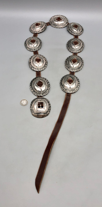 10 conchos,  detailed file work, hand stamped designs and repousse silver work