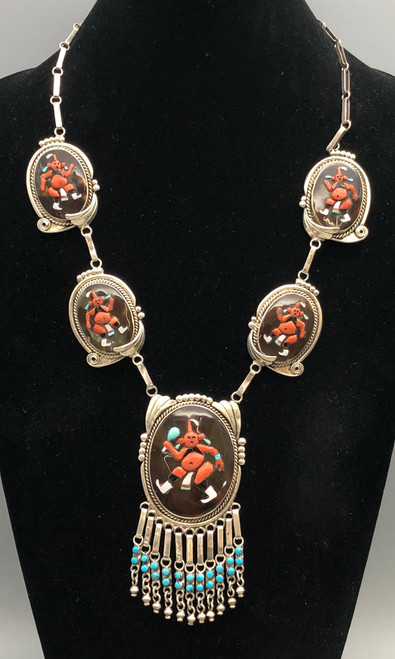 mudhead themed coral inlay, bracelet, five-pendant necklace, ring, and six-piece concho belt
