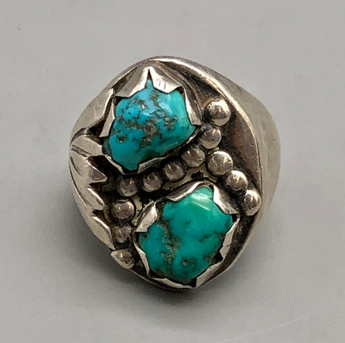 two turquoise cabochons, with unique handmade silver bezels