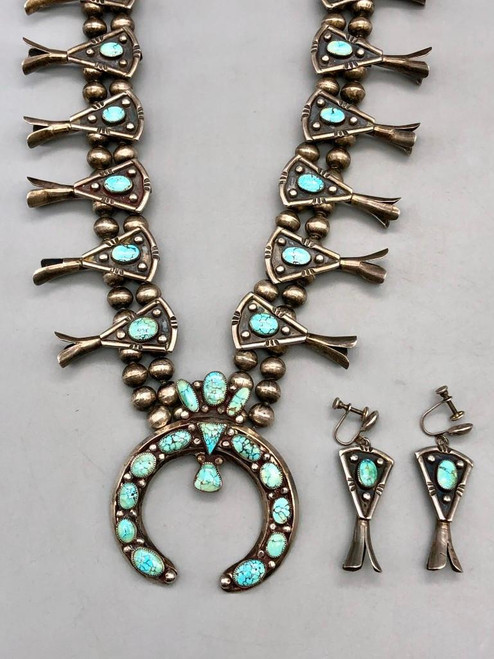set with older webbed #8 turquoise, classic naja holds 15 gorgeous turquoise cabochons, 18 beautiful three petal blossoms