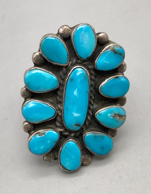 11 bright blue turquoise cabochons in a dashing cluster