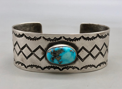 1940s-1950s, nice turquoise cabochon in the center, hand stamping