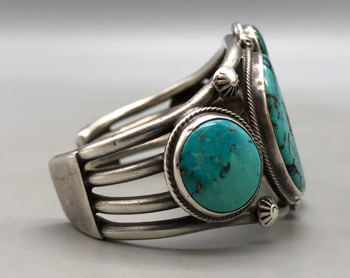 vintage hefty handmade turquoise bracelet, seven gorgeous turquoise cabochons, four wire conjoined terminal