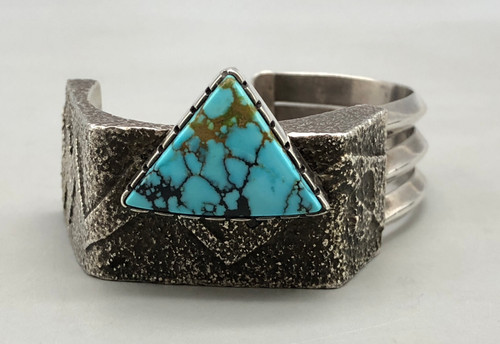 unique multi style turquoise bracelet by Richard Tsosie, offset triangular turquoise stone, tufa cast design