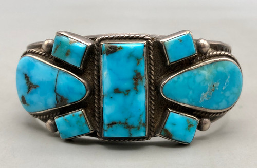 1920s-1940s seven stone natural turquoise bracelet, seven stunning natural turquoise cabochons, each displayed in smooth silver bezels