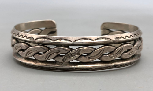older handmade coin silver marked bracelet, carinated bands with conjoined ends, center twisted wire, hand stamped designs