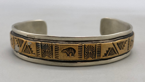 sterling silver storyteller style bracelet,  brass overlay design, hand stamped feather design, solid cuff