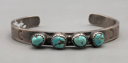 ingot bracelet, four turquoise cabochons, circa 1920s to 1930s, handmade sawtooth bezels, raised dot accents, hand stamped designs, solid cuff