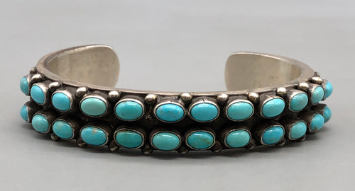 hefty two row turquoise bracelet,  deep stamping, darkened silver background, smooth silver cuff
