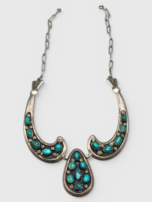 bib style design, natural turquoise, darkened background, handmade silver link chain, Martha Willeto