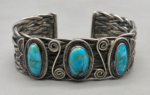 Circa 1920s to 1930s, handmade braided wire and turquoise, three turquoise stones, braided four wire terminal