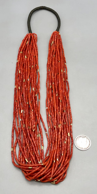 21 strand, coral and gold beads, black Pueblo wrap,