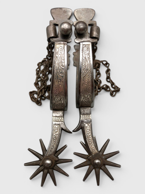 California style, silver inlay, single mounted, 10 point rowel, chap guards, heel chains, Circa 1920s