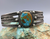Hand stamped Fred Harvey  era cuff, with a turquoise stone that has a lovely tan/brown matrix.