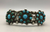 A handmade Fred Harvey era cuff, with a dot (flower) design.