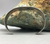 A Fred Harvey era cuff, with two turquoise cabochons and fluted silver drop.