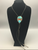 Carved turquoise and coral bolo tie