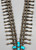 Unique Crossed Theme Turquoise and Sterling Silver Squash Blossom