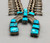 Unique Crossed Theme Turquoise and Sterling Silver Squash Blossom