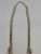 Zuni peach coral inlay and sterling silver squash blossom necklace, two strands of sterling silver beads, foxtail wire