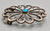 sandcast and turquoise belt buckle, flower or wave like design, turquoise cabochon