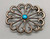 sandcast and turquoise belt buckle, flower or wave like design, turquoise cabochon