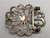 sandcast and turquoise belt buckle, flower or wave like design, turquoise cabochon