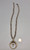 vintage naja necklace with cross, hand stamped designs, sterling silver, strung on a coated wire