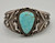 vintage Navajo UITA-15 bracelet, turquoise cabochon at the center, twisted wire, hoops, and dots, United Indian Traders Association (UITA)