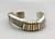 sterling silver and gold bracelet by award winning artist Edison Cummings, symmetrical carved line of silver, substantial weighted feel