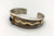 sterling silver, gold, and lapis bracelet by multiple award winning artist Edison Cummings, lapis cabochon in a gold bezel, geometric arrow