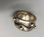 his and hers sterling silver and gold rings by award winning artist Edison Cummings, geometric design with a darkened silver background, 14K yellow gold