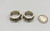 his and hers sterling silver and gold rings by award winning artist Edison Cummings, geometric design with a darkened silver background, 14K yellow gold