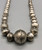 vintage Navajo pearl necklace, graduating sizes, conjoined by silver findings and strung on a link chain