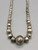 vintage Navajo pearl necklace, graduating sizes, conjoined by silver findings and strung on a link chain