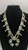 unique squash blossom necklace set with a matching ring, great turquoise nugget cabochons throughout the naja and blossoms, silver applique