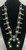 vintage squash blossom necklace, classic naja style with eight beautiful green turquoise cabochons, sterling silver and strung on a coated wire